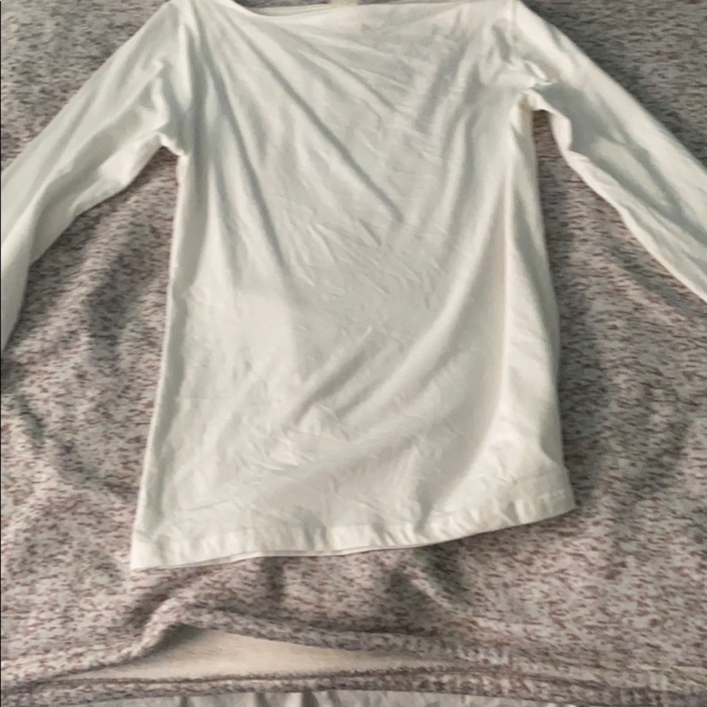 a white off the shoulder shirt